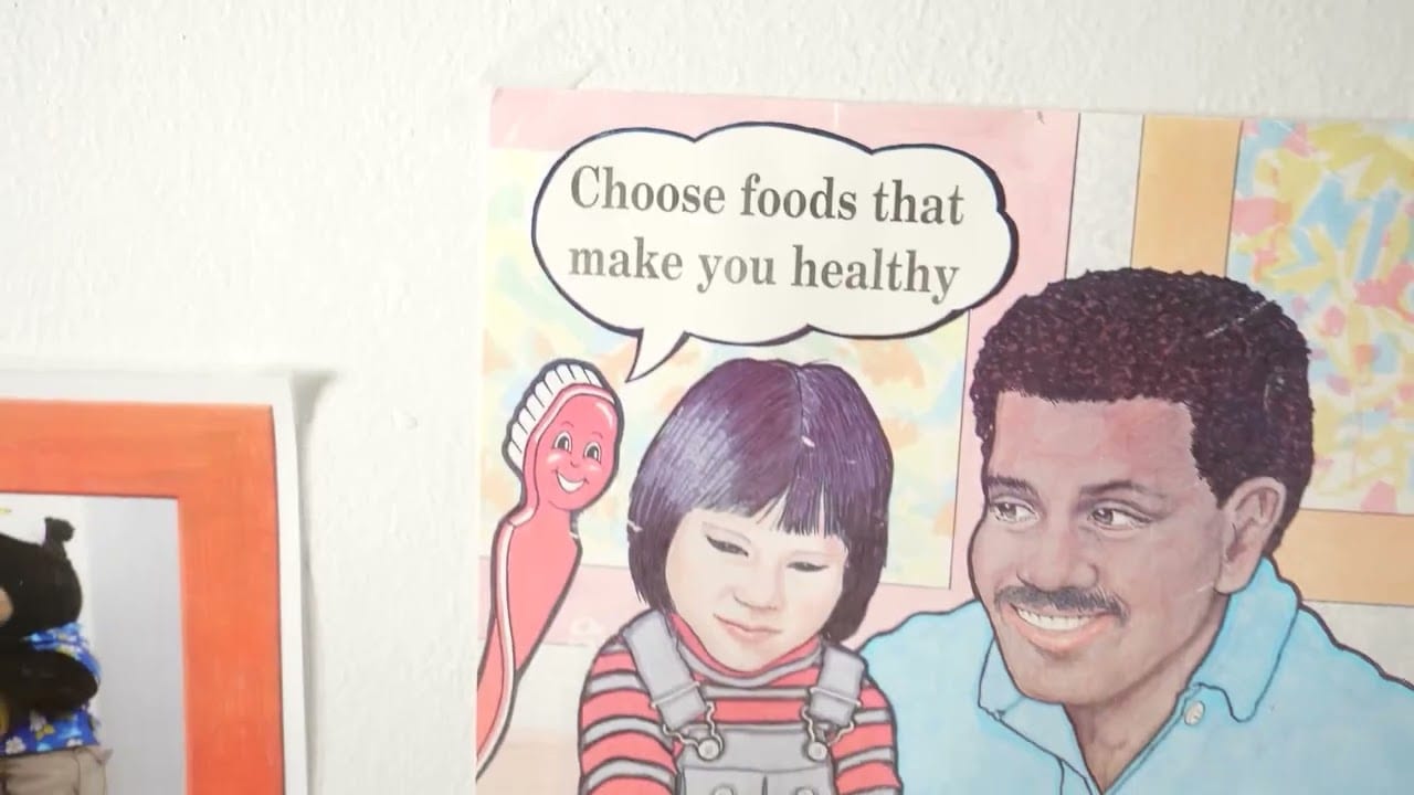 Children's illustration with a person encouraging a child to choose foods that make them healthy.